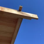 debord de toiture en bois avec volige en sous face